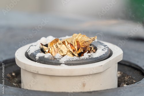 Canvas Print Gold leaf melting in a crucible during a refining process showing intense heat and transformation of precious metal