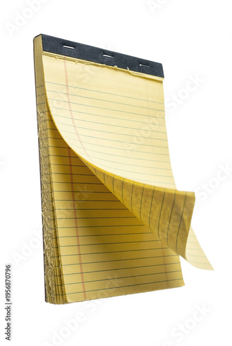 Yellow legal pad with a flipping page
