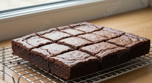 Delicious homemade chocolate brownies cooling on a wire rack.