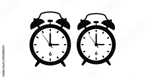 Two vintage alarm clocks displayed side by side with differing times