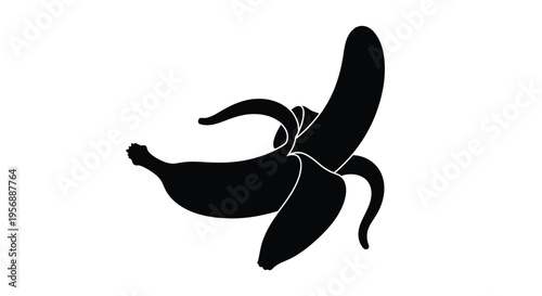 A striking black silhouette of a partially peeled banana