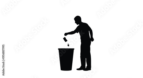 A man discarding a can into a wastebasket stark silhouette