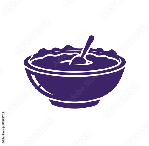 Deep purple bowl with a spoon in it filled with a thick purple substance isolated on white background