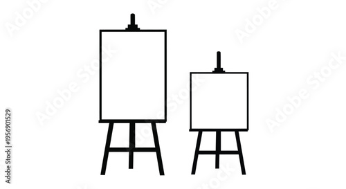 Two black easels with blank white canvases differing in size