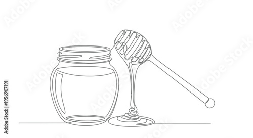 Jar of honey with a honey dipper and dripping honey