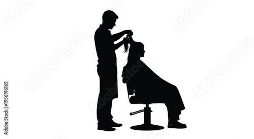 A barber cuts a client s hair in a striking silhouette