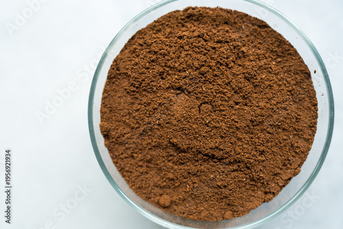 Ground coffee fill in glass jar. Top view