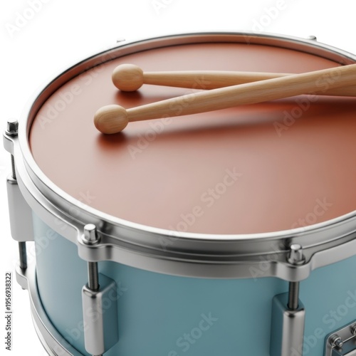 Close-up of a snare drum with drumsticks