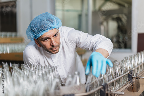 Photography Glass bottle and food packaging manufacturing plant worker Product Visual Inspection in plant line