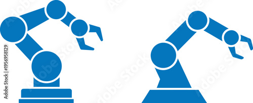 Two industrial robotic arms performing tasks in a manufacturing setting