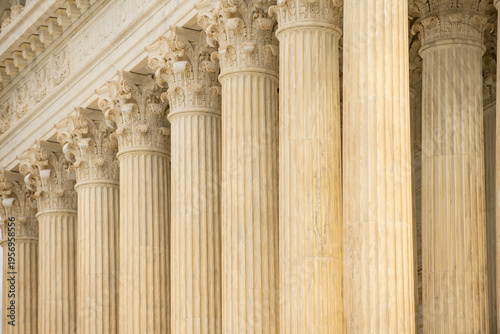 Columns architectural heritage marble exterior. Columns repetition symmetry texture. Columns decorative capitals ornament elements. Columns neoclassical structure design.