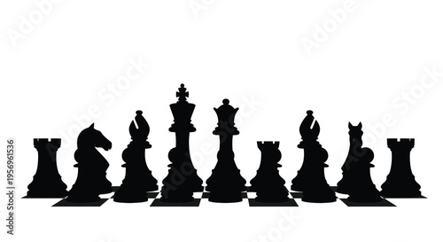 Black chess pieces arranged in a row dramatic silhouette