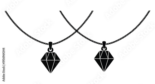 Two diamond pendants suspended on chains a striking black silhouette