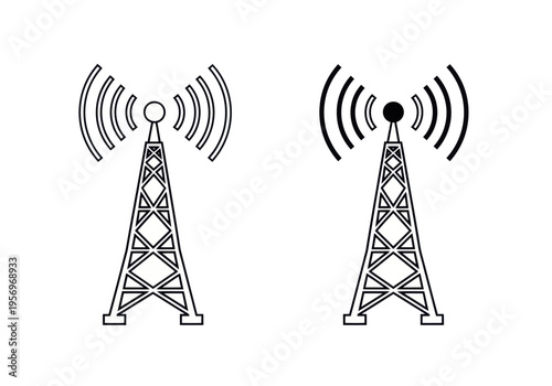 Two communication towers emitting signals side by side outdoors