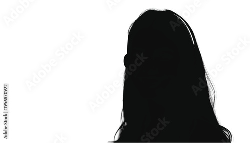 Rear view silhouette of a woman with very long flowing hair facing away from the viewer on a white backdrop.