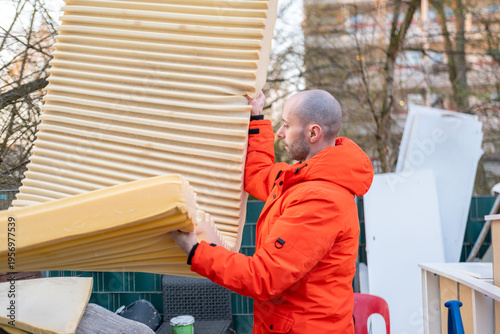 man bringing old items bulky waste collection point, disposing belongings, recycling and donation culture, Sustainable lifestyle, responsible consumption and eco lifestyle, Fight against consumerism
