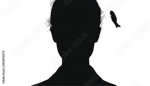 Silhouette of a person's head features a small fish figure flying away from their mind.