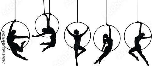 Silhouettes of people performing aerial acrobatics in hanging rings against a white background black and white
