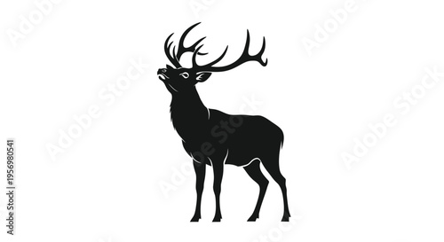 Silhouette of a majestic stag with large branching antlers presented in profile