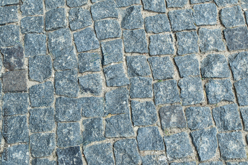 Cobblestone street surface showing unique patterns and colors in a historic town during daylight in spring