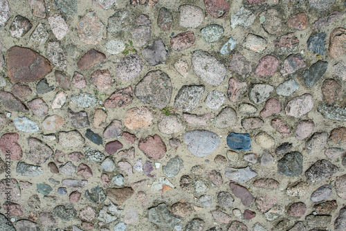 Variety of stones arranged on ground in different colors and shapes at a natural setting during daytime