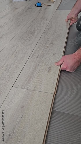 Installing wooden floor with interlocking pieces in a home renovation project