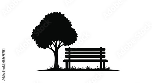 A solitary park bench rests beneath a leafy tree silhouette