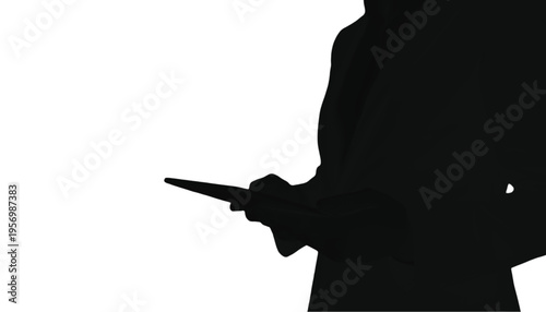 Partial silhouette of an individual holding a small electronic tablet or device in their hand.