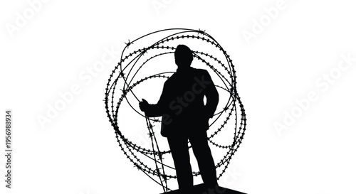 Man standing near coiled barbed wire a stark black silhouette