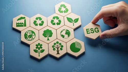 Hand placing a wooden hexagonal tile labeled e s g next to a cluster of representing environmental sustainability goals