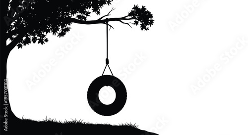A solitary tire swing hangs beneath a tree branch silhouette