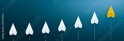 Success in business growth concept. Yellow paper plane on blue background