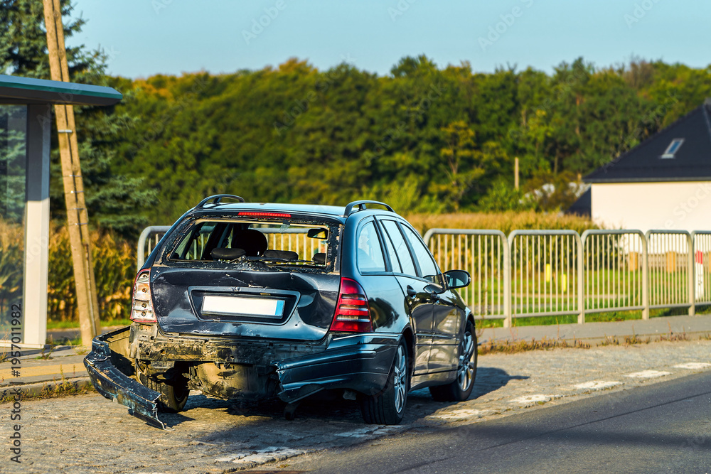 Fototapeta premium Damaged vehicle stopped on quiet roadside