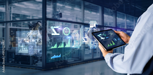 Smart industry control concept.Manager Engineer Hands holding tablet on blurred automation machine as background
