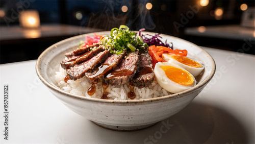 Steaming beef rice bowl with soft boiled egg and vegetables