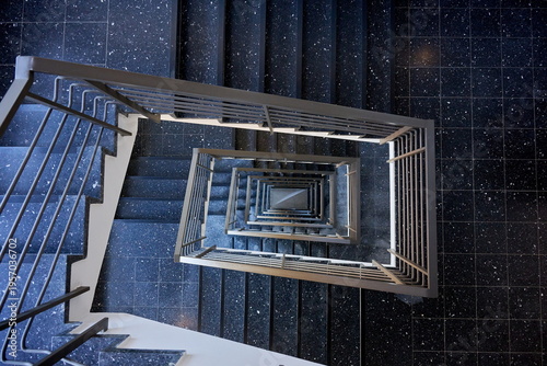 Abstract Top-Down View of Modern Spiraling Staircase with Terrazzo Flooring