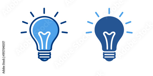 Two lightbulbs with different shades of blue and white lines radiating from them on a plain white background