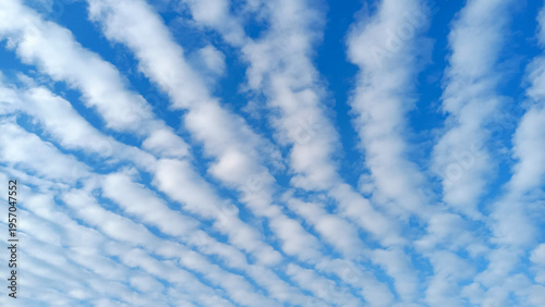 Blue sky with white puffy clouds, beautiful sky background texture. Clean air and clouds