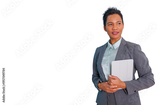 Confident businesswoman holding tablet, looking away with a visionary and professional expression, transparent background
