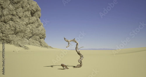 A solitary, bent branch rises from the sandy ground in a vast desert. Surrounding rock formations and a clear blue sky create a serene yet stark environment at midday.