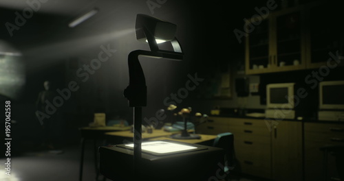 A dimly lit classroom features an overhead projector on a table. Shadows cast on the wall create a mysterious atmosphere, evoking nostalgia for past lessons and presentations.