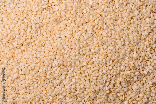 Obraz na płótnie White sesame seeds in a bowl, an ingredient for oil and healthy eating