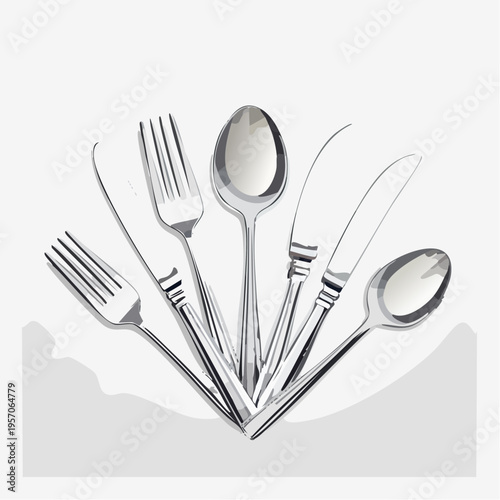 Group of silver cutlery arranged on a simple background during kitchen preparation