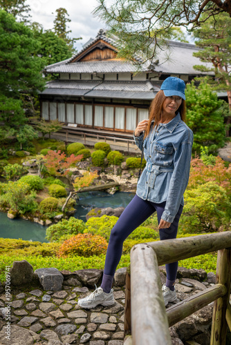 Portrait of Young Caucasian Woman Wearing Navy Clothing and Cap at Yoshikien Garden Nara