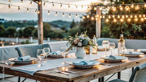 Elegant outdoor dining table set for evening gathering with lights  