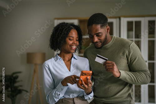 African american couple shopping online with credit card