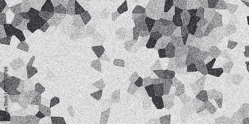Abstract grayscale mosaic pattern with granular texture and irregular polygonal shapes creating a textured background for design and digital art applications
