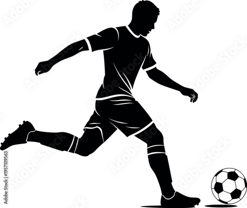 Silhouette of a soccer player kicking a ball