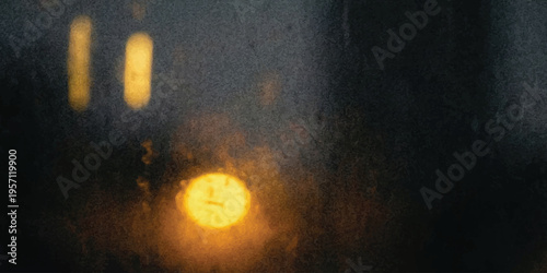 Blurred yellow city lights seen through wet window glass with rain drops