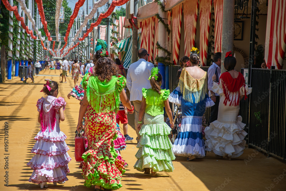 Fototapeta premium colorful flamenco dresses at the Feria de Abril in Seville
